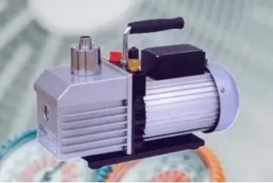 Professional rotary vane vacuum pump with pressure gauge and motor assembly available at Joo Huat Chai Kee